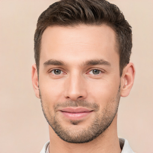 Joyful white young-adult male with short  brown hair and brown eyes