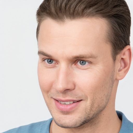 Joyful white adult male with short  brown hair and brown eyes