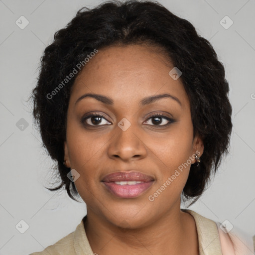 Joyful black adult female with long  brown hair and brown eyes