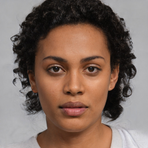 Neutral black young-adult female with short  black hair and brown eyes