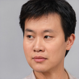 Neutral asian young-adult male with short  black hair and brown eyes