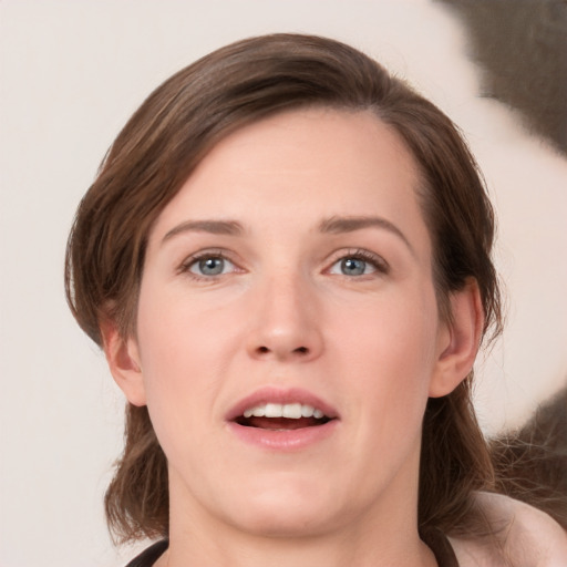 Joyful white young-adult female with medium  brown hair and brown eyes