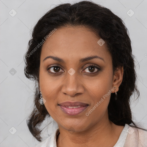 Joyful black adult female with medium  brown hair and brown eyes