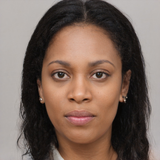 Neutral latino young-adult female with long  black hair and brown eyes