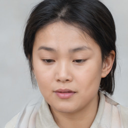 Neutral asian young-adult female with medium  brown hair and brown eyes