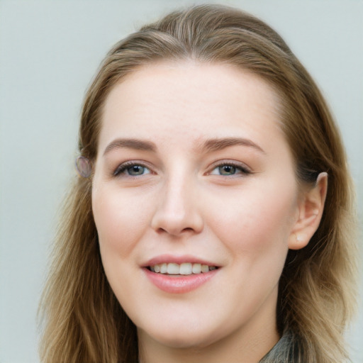 Joyful white young-adult female with long  brown hair and grey eyes