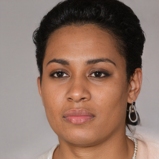 Neutral black young-adult female with short  black hair and brown eyes