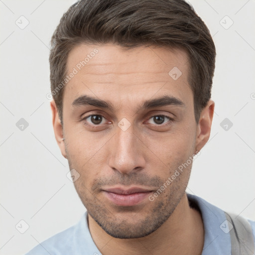 Neutral white young-adult male with short  brown hair and brown eyes