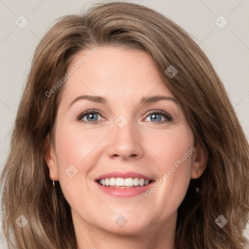 Joyful white young-adult female with long  brown hair and green eyes