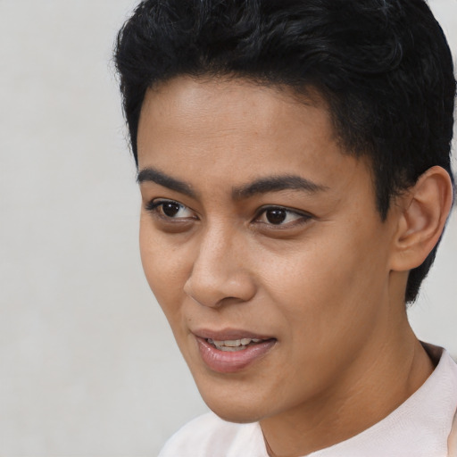 Joyful latino young-adult female with short  black hair and brown eyes