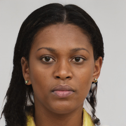 Neutral black young-adult female with long  brown hair and brown eyes