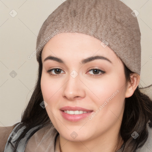 Joyful white young-adult female with long  black hair and brown eyes