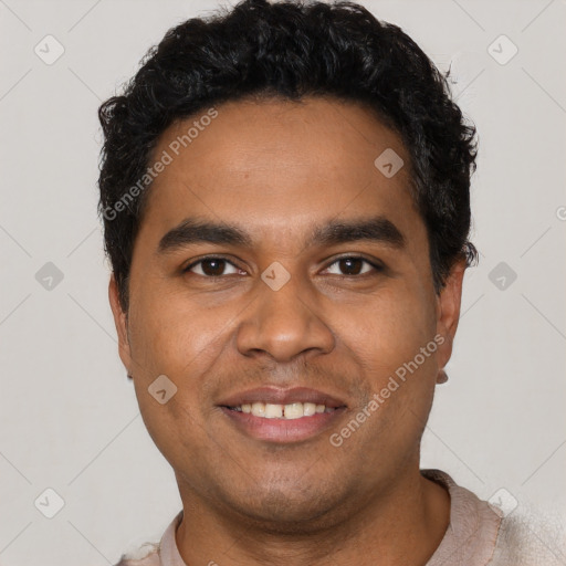 Joyful latino young-adult male with short  black hair and brown eyes