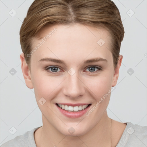 Joyful white young-adult female with short  brown hair and grey eyes