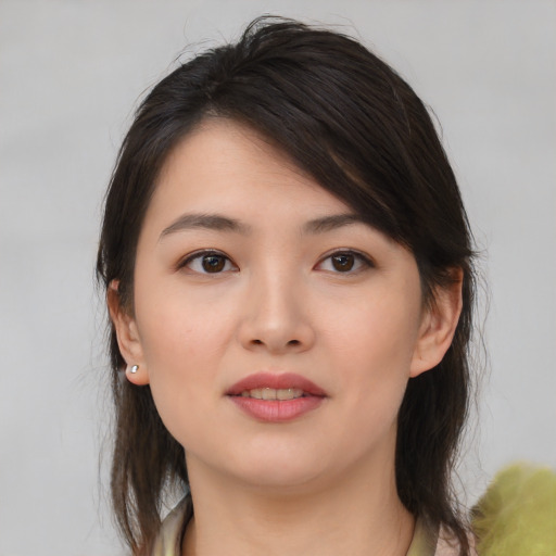 Neutral asian young-adult female with medium  brown hair and brown eyes