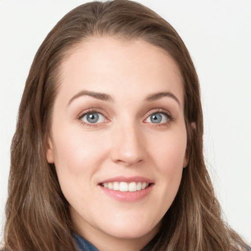 Joyful white young-adult female with long  brown hair and blue eyes