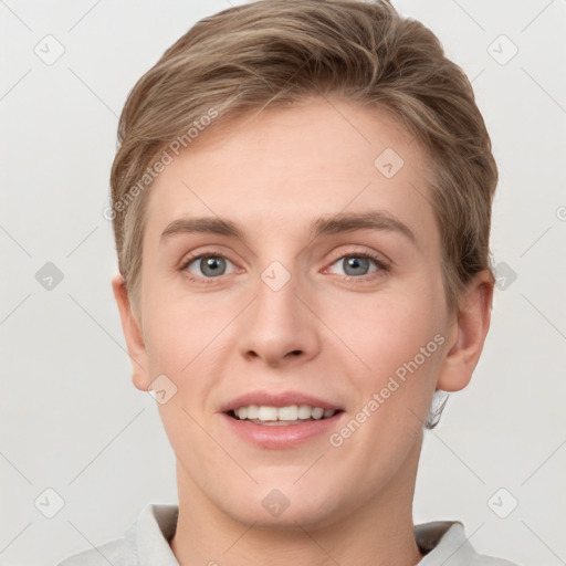 Joyful white young-adult female with short  brown hair and grey eyes