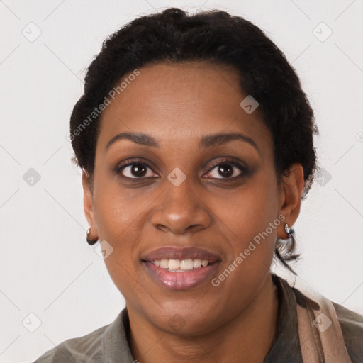 Joyful black young-adult female with short  brown hair and brown eyes