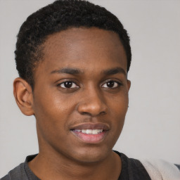 Joyful black young-adult male with short  brown hair and brown eyes