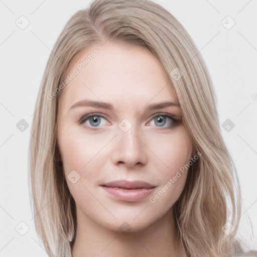 Joyful white young-adult female with long  brown hair and blue eyes