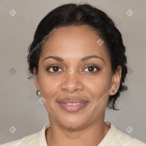 Joyful black adult female with medium  brown hair and brown eyes