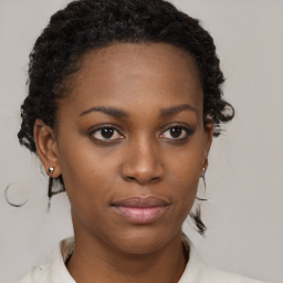 Neutral black young-adult female with short  brown hair and brown eyes