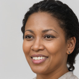 Joyful black adult female with short  brown hair and brown eyes