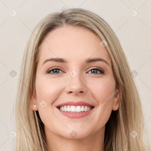 Joyful white young-adult female with long  brown hair and grey eyes