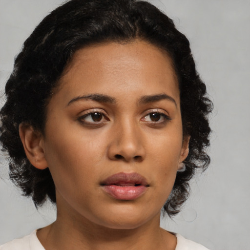 Neutral latino young-adult female with medium  black hair and brown eyes