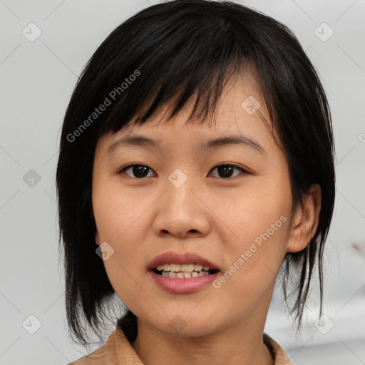 Joyful asian young-adult female with medium  black hair and brown eyes