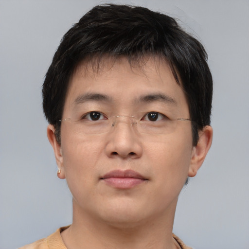 Neutral asian young-adult male with short  brown hair and brown eyes