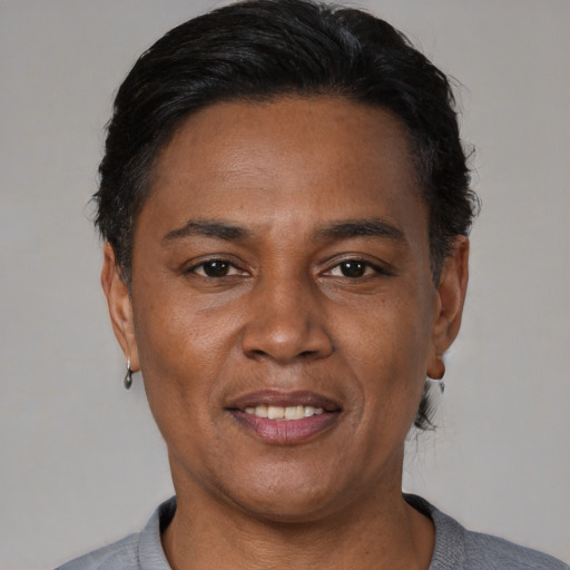 Joyful asian adult male with short  black hair and brown eyes