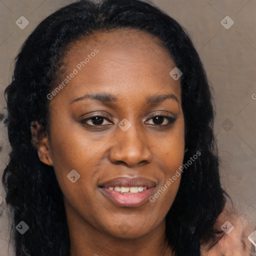 Joyful black young-adult female with long  black hair and brown eyes