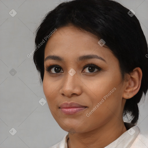 Joyful black young-adult female with medium  black hair and brown eyes