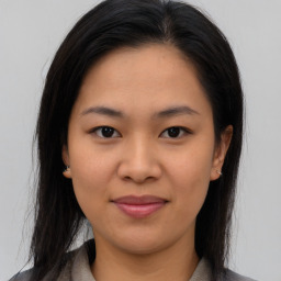 Joyful asian young-adult female with medium  brown hair and brown eyes