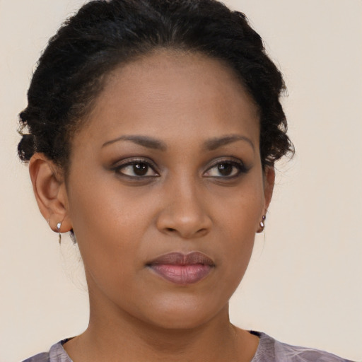 Neutral black young-adult female with short  brown hair and brown eyes