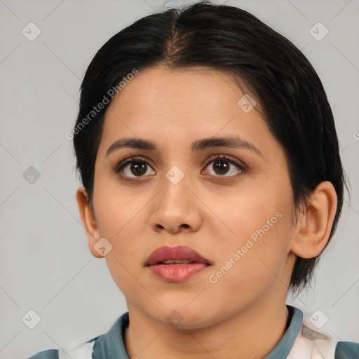 Joyful latino young-adult female with medium  brown hair and brown eyes