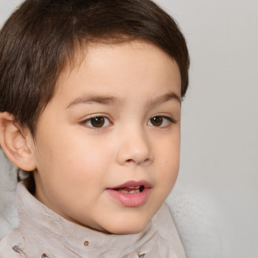 Joyful white child male with short  brown hair and brown eyes