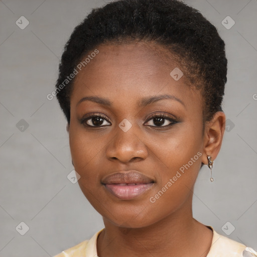 Joyful black young-adult female with short  brown hair and brown eyes