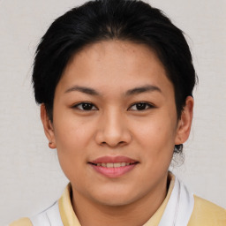 Joyful asian young-adult female with short  brown hair and brown eyes