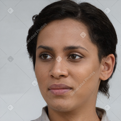 Joyful latino young-adult female with medium  brown hair and brown eyes