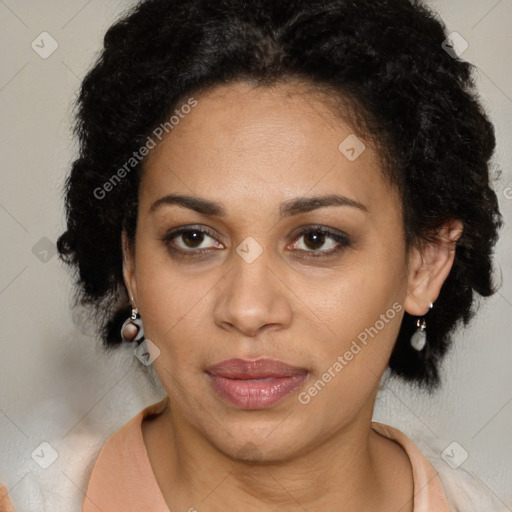 Joyful latino adult female with medium  brown hair and brown eyes