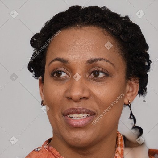 Joyful black adult female with short  brown hair and brown eyes