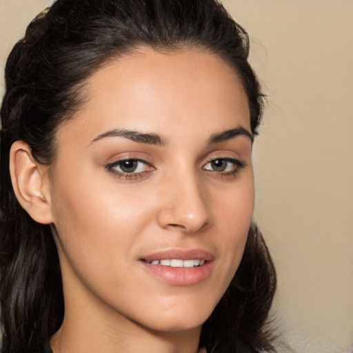 Joyful white young-adult female with long  brown hair and brown eyes