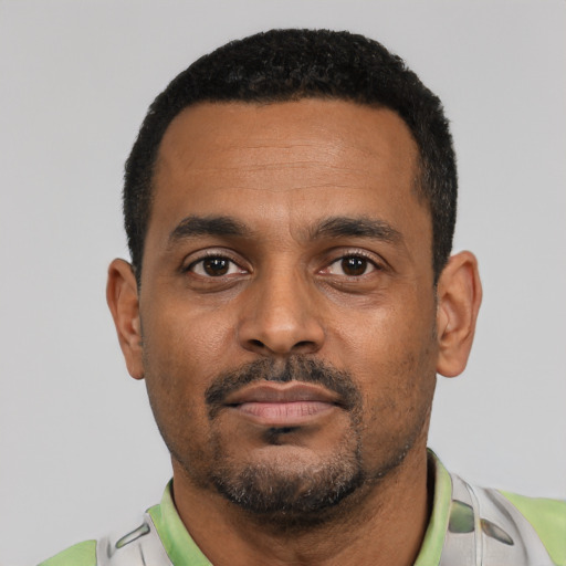 Neutral black young-adult male with short  black hair and brown eyes