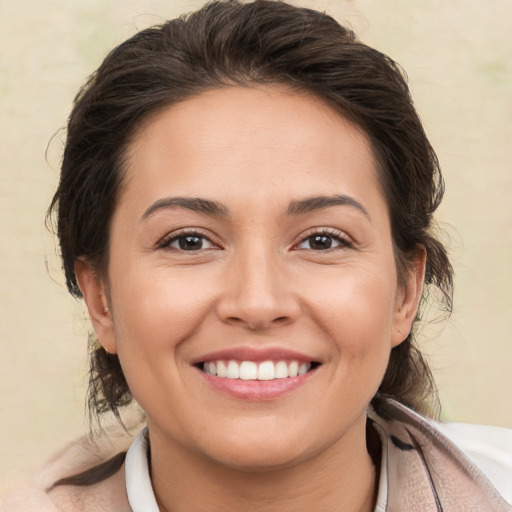 Joyful white young-adult female with medium  brown hair and brown eyes