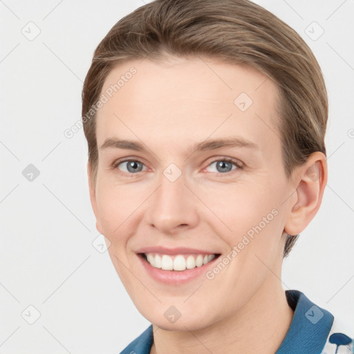 Joyful white young-adult female with short  brown hair and grey eyes