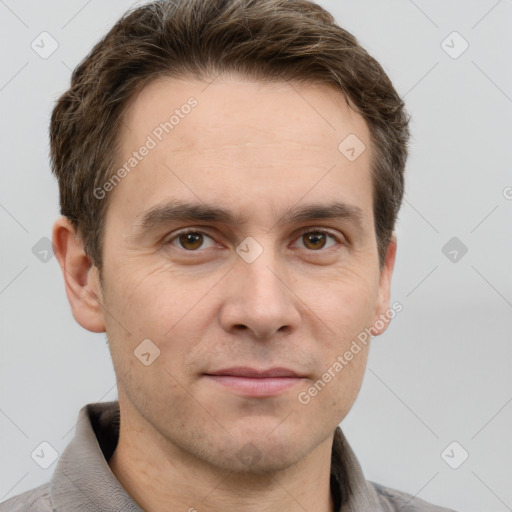 Joyful white adult male with short  brown hair and grey eyes