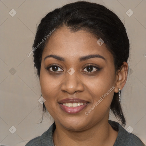 Joyful black young-adult female with medium  black hair and brown eyes