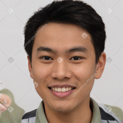 Joyful asian young-adult male with short  brown hair and brown eyes